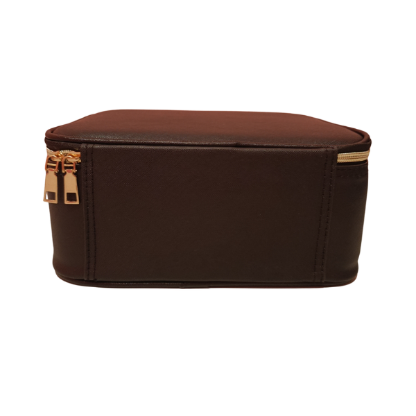 Closed gold zipper of a black led mirror makeup bag.